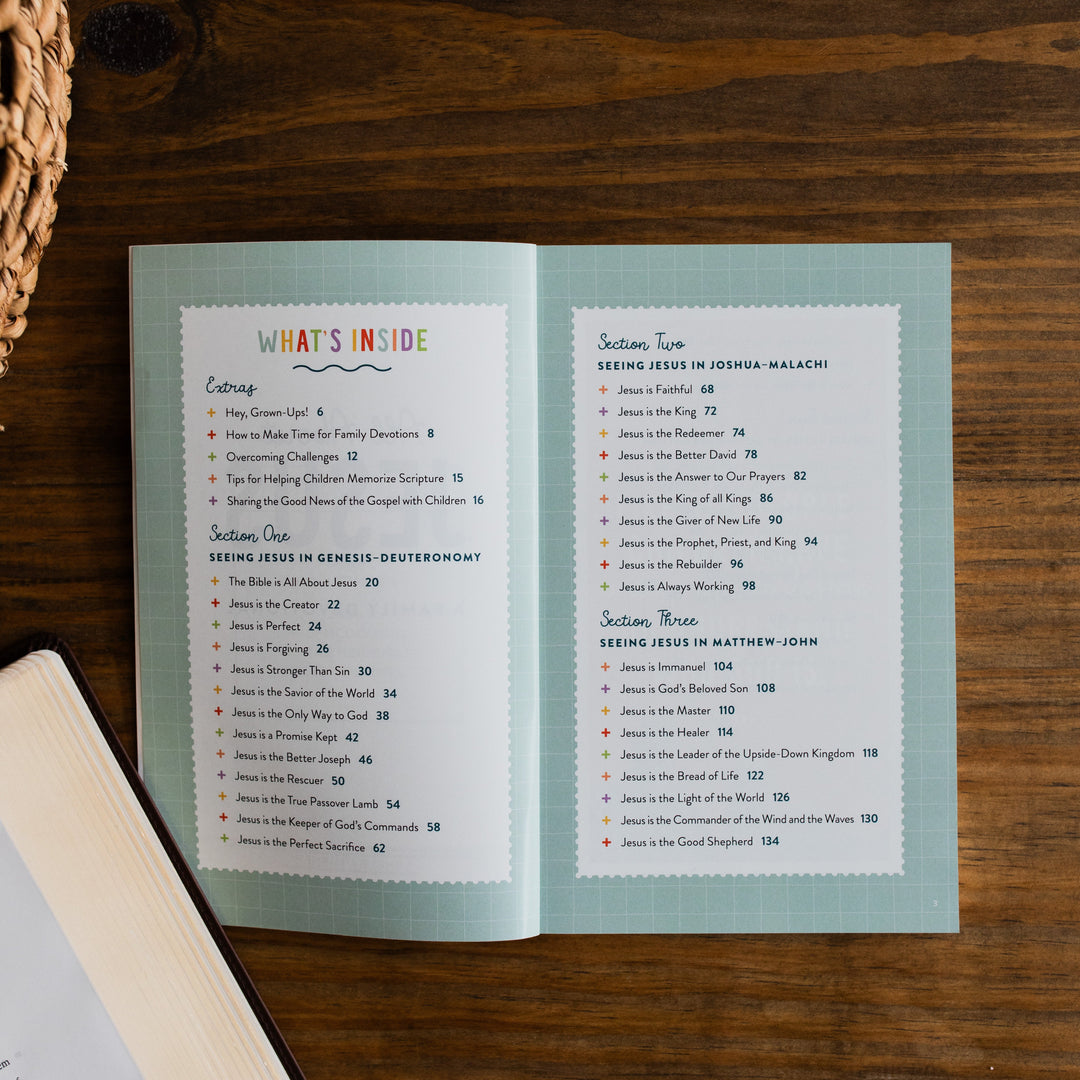 Open book with table of contents on a wooden surface
