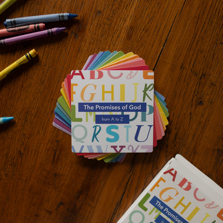 The Promises of God Verse Card set stacked on a wooden table