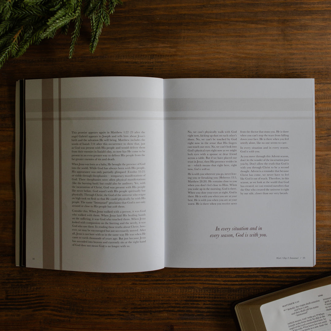The Awakening Wonder opened to the reading for week 1 day 2 page on a wooden table