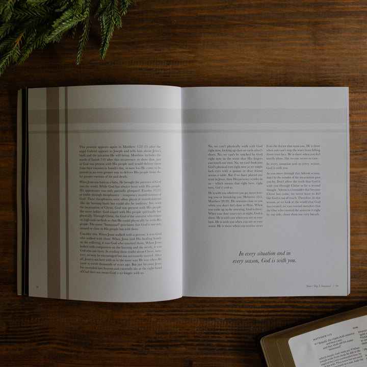 The Awakening Wonder opened to the reading for week 1 day 2 page on a wooden table