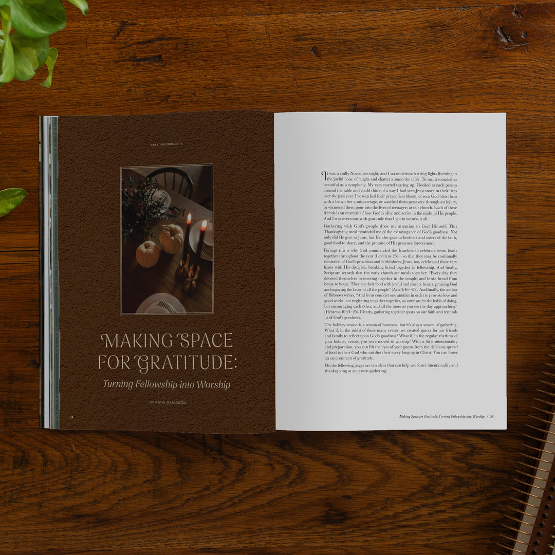 An open printed magazine spread laid flat on a wooden table. The left page is dark brown with a small inset photo and the title 'Making Space for Gratitude: Turning Fellowship into Worship.