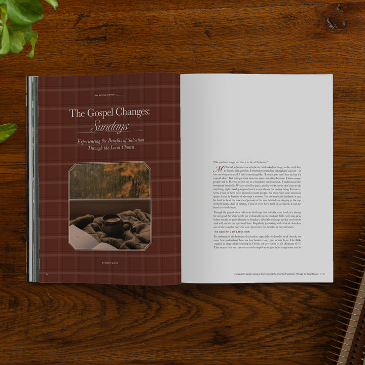 An open magazine spread laid flat on a dark wood tabletop. The left page has a burgundy plaid header with the title 'The Gospel Changes: Sundays' and a small inset photo; the right page contains columns of text.