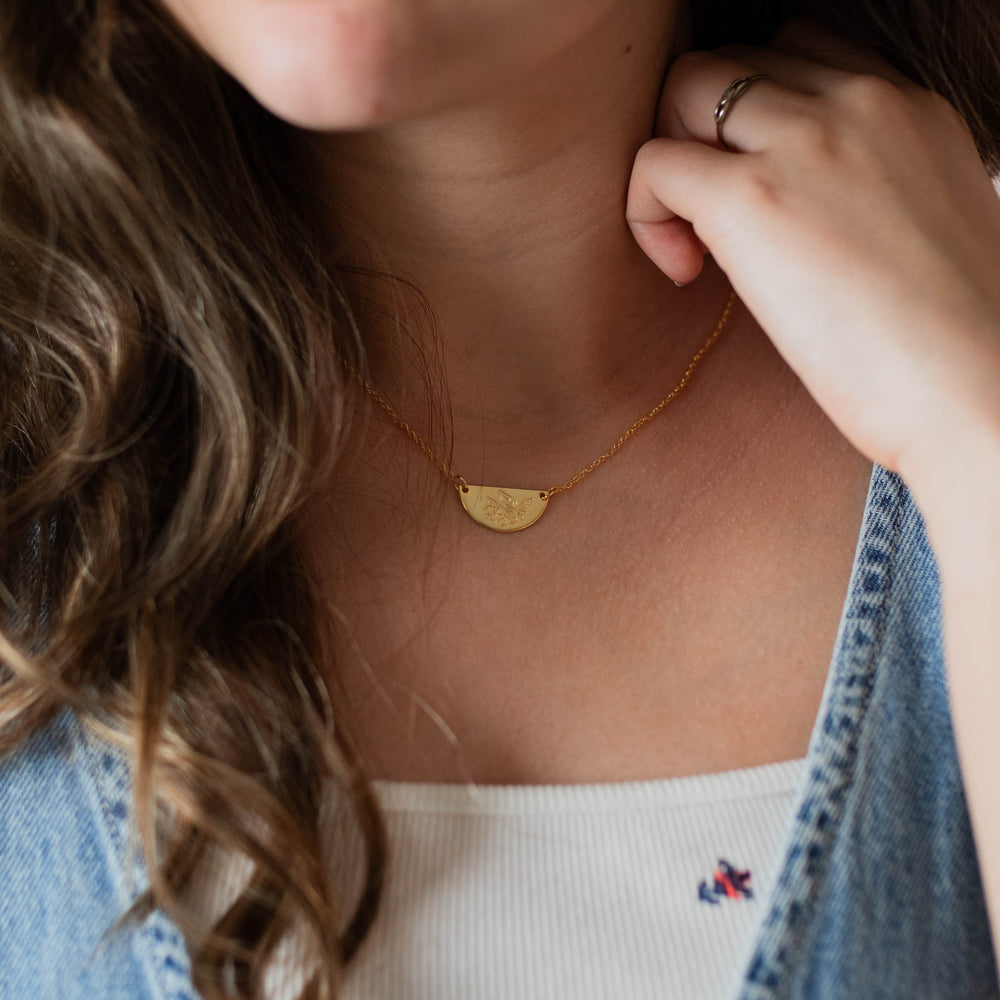 woman wearing christian necklace