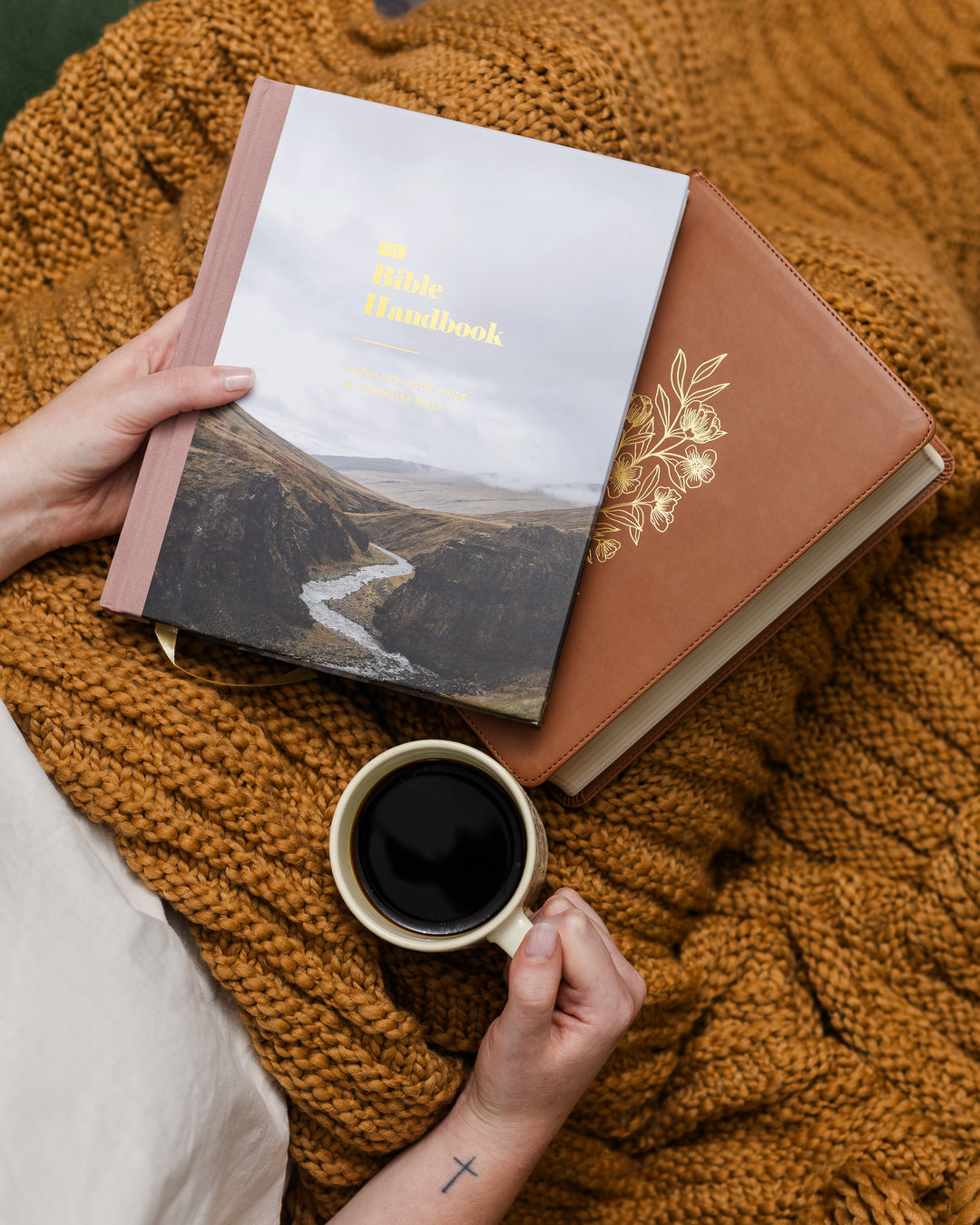 Woman holding handbook and bible with cup of coffee