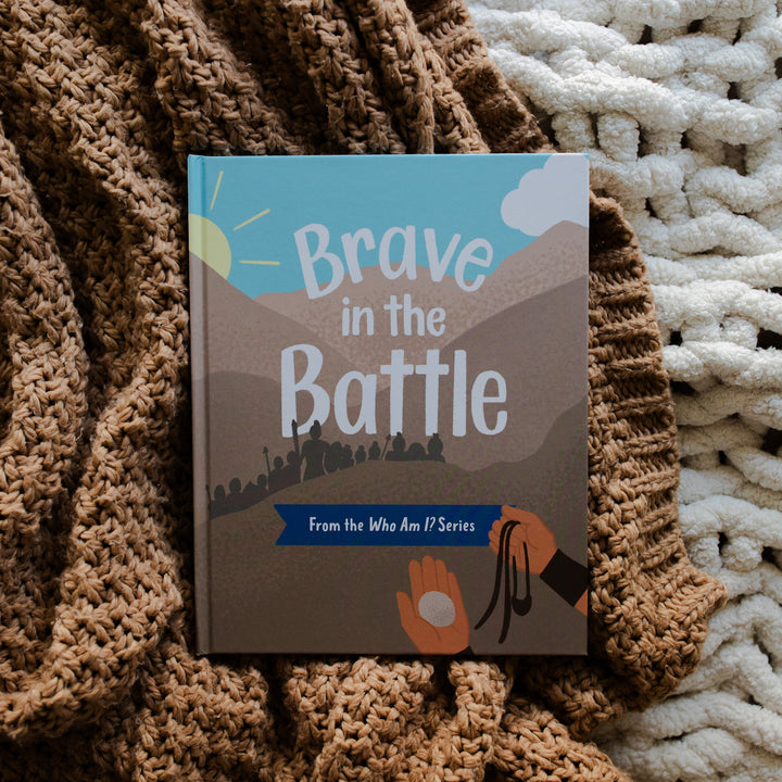 Brave in the Battle book cover on a brown knitted blanket and a white knitted blanket