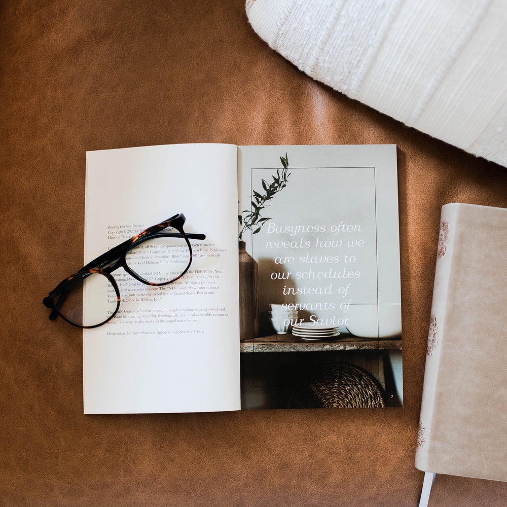 Breaking Free From Busyness book on couch with bible