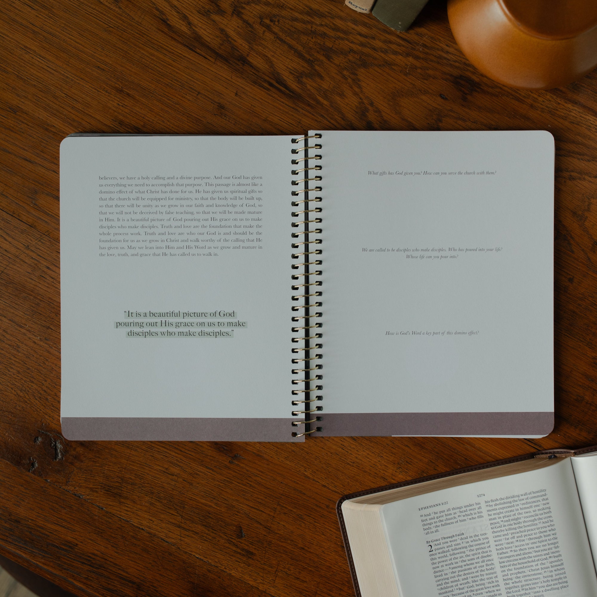 Chosen study opened to the discussions and questions page on a wooden table near an open bible