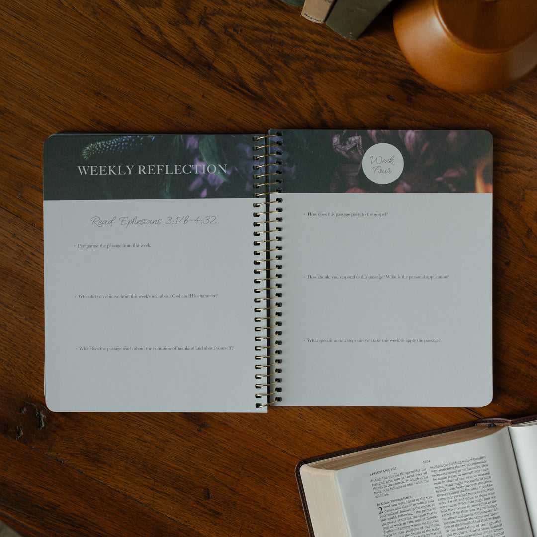 The Chosen Ephesians study opened to the weekly reflections page on a wooden table and an open bible