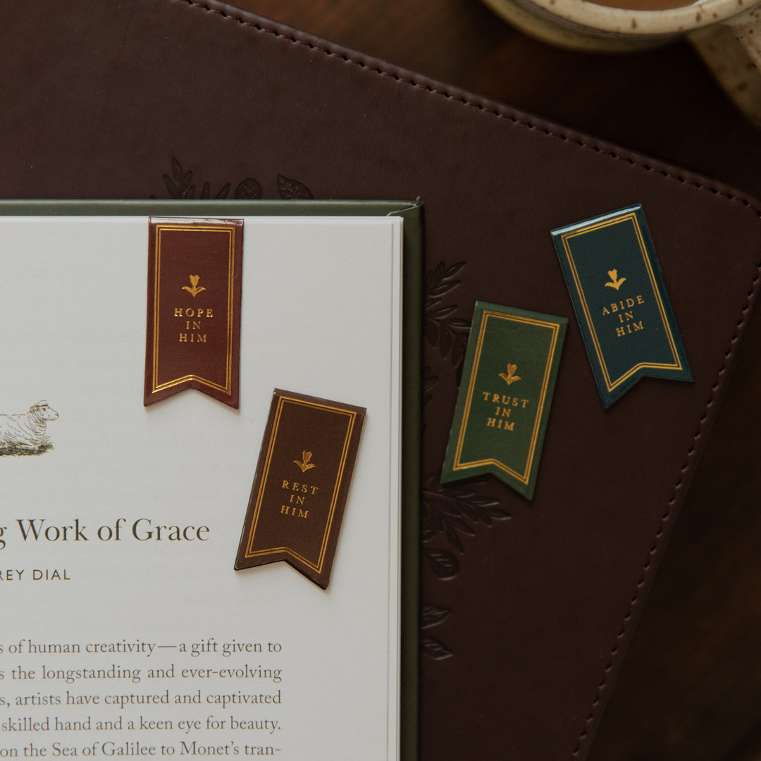 Two Magnetic Bookmarks on the corner of a page and Two bookmarks on a closed bible