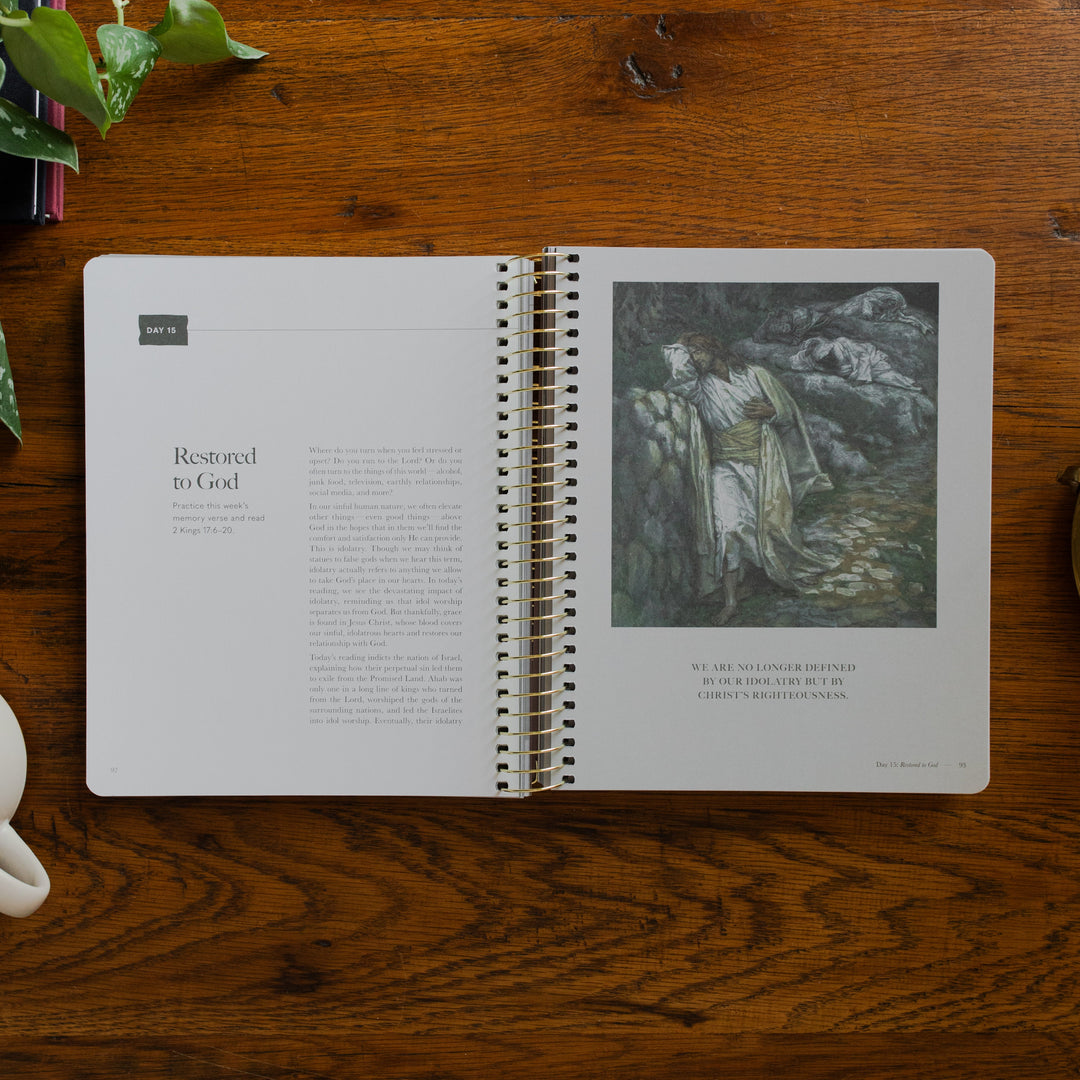 Clinging to the Cross Spiral study opened to the restored to God page on a wooden table