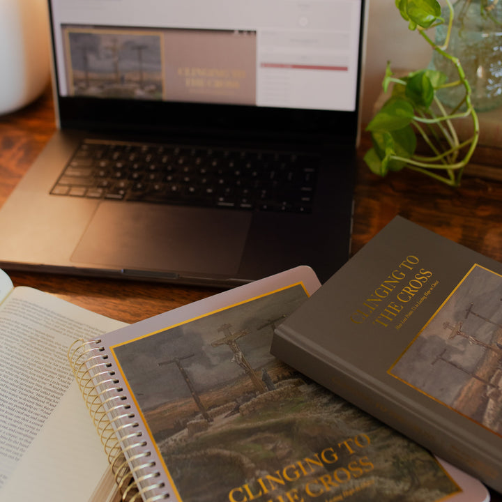 Clinging to the Cross loaded on a computer near two closed Clinging to the Cross studies