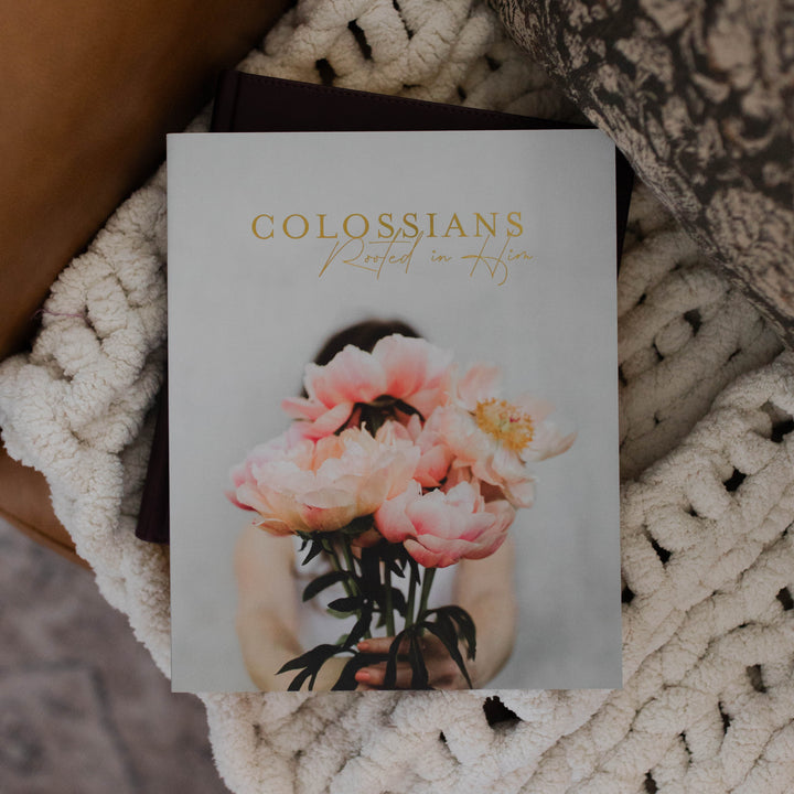 Bible study on the book of Colossians sitting on a blanket