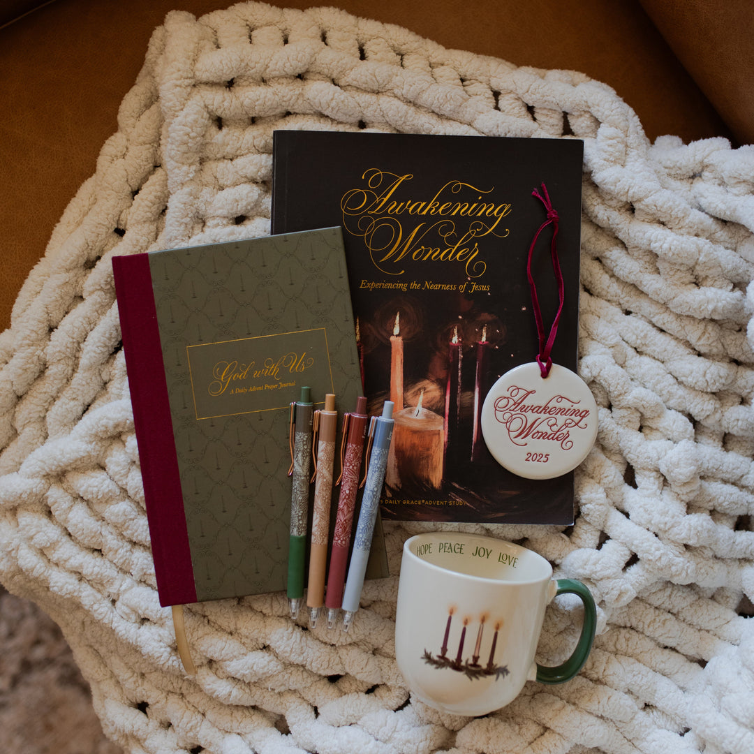 The Cozy Quiet Time Bundle with the Advent Mug all laying on a white knitted blanket