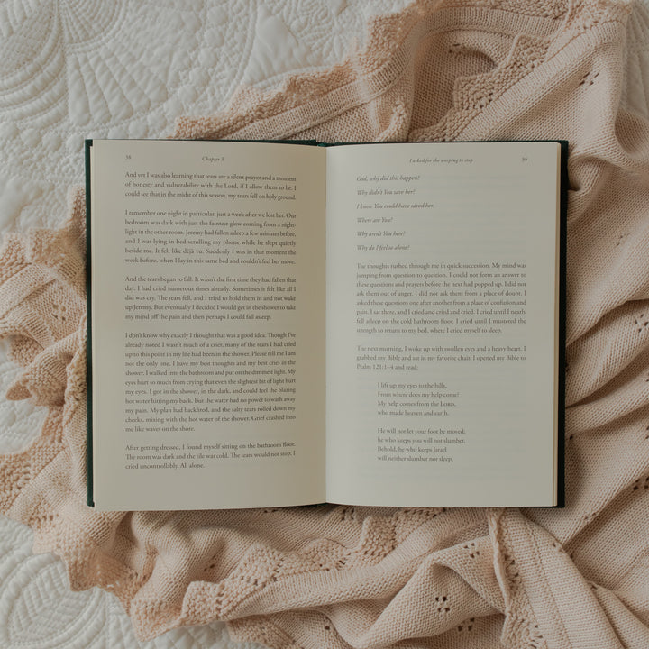 The Daily Grace Hardcover book opened to the chapter 3 reading portion of the page on some white sheets