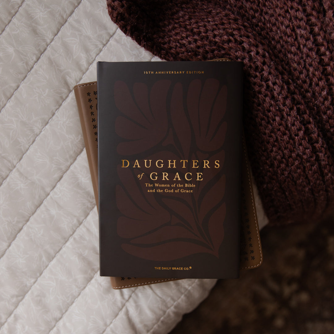 Book titled 'Daughters of Grace' on a textured surface