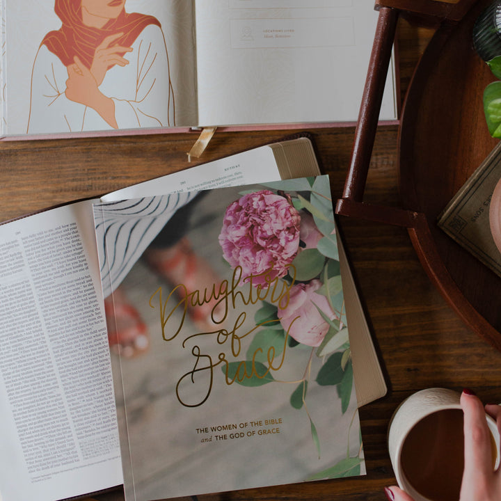 Daughters of Grace Bible Study on Bible with Women of the Bible in the background