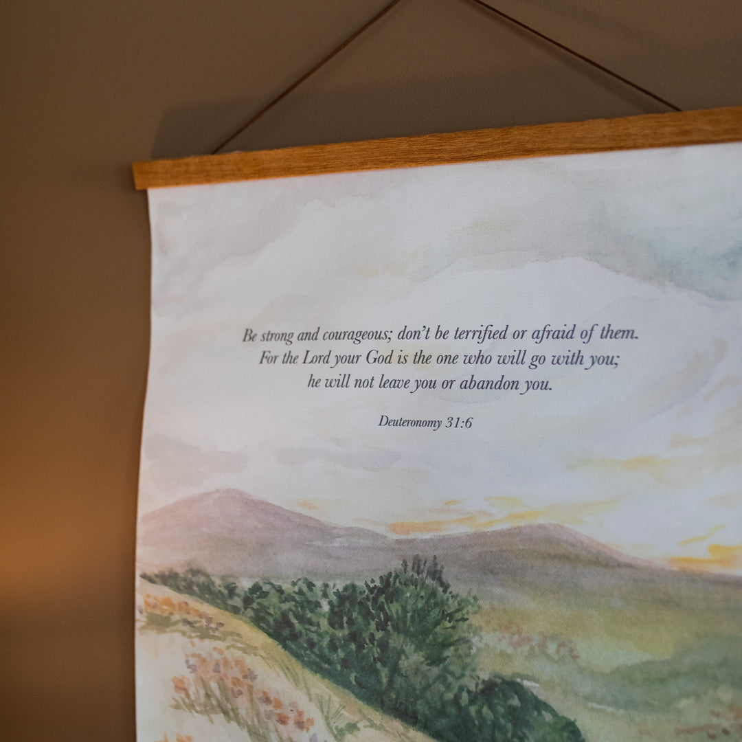 Field Watercolor Hanging Canvas hanging on a brown wall
