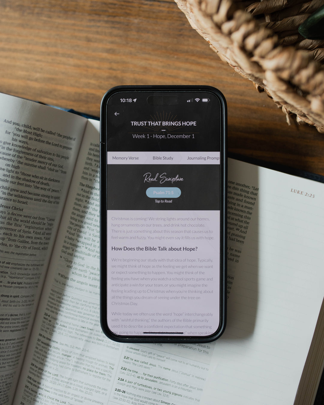 A iphone with a digital study on it on top of a Bible