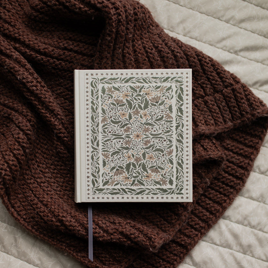 The ESV Bible Roman cover on a brown blanket