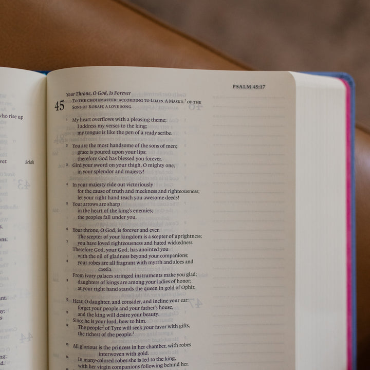 ESV Garden Bible opened to Psalms 45 up close on a leather couch