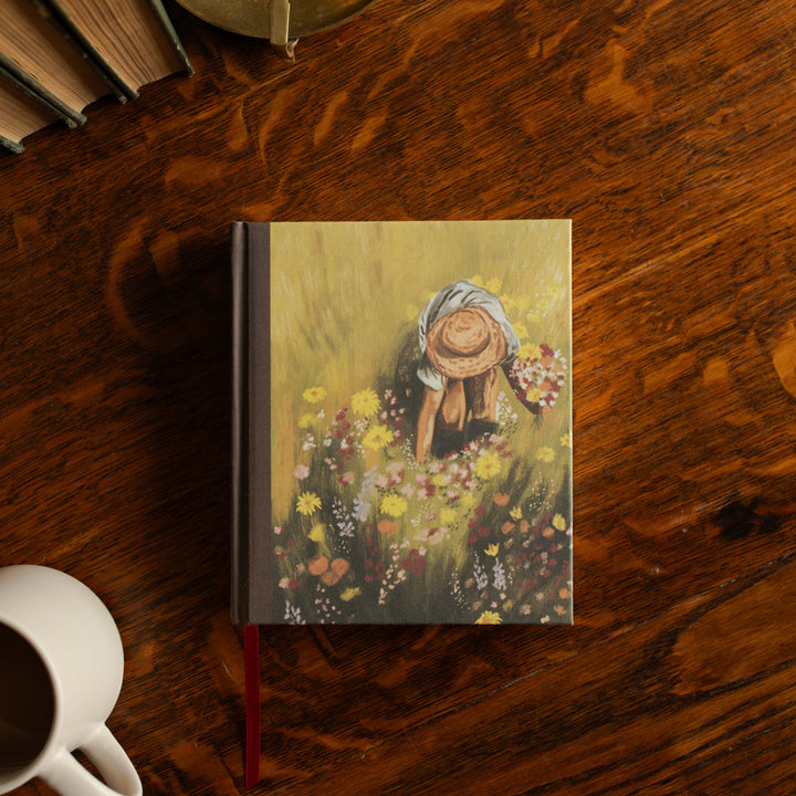 ESV journaling Fields Bible cover on a wooden table next to a white coffee cup