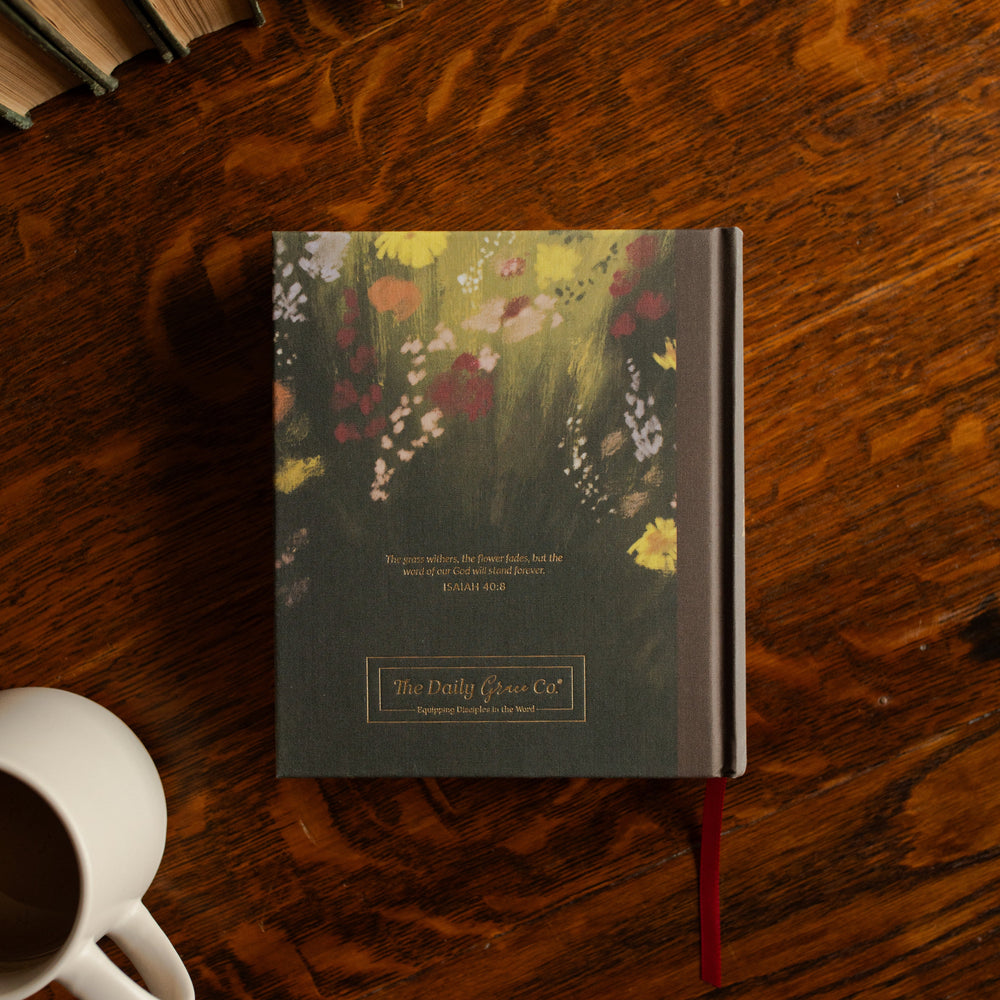 ESV journaling Fields Bible back cover on a wooden table next to a white coffee cup