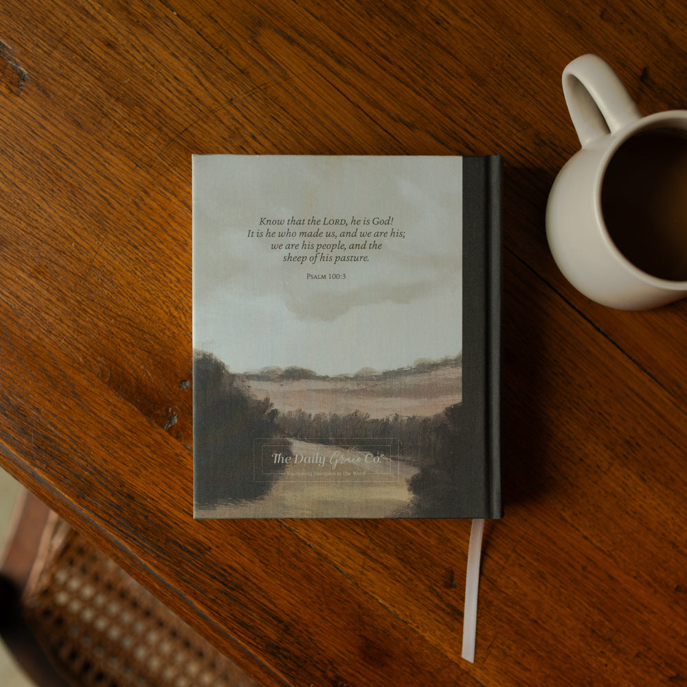 ESV Journaling Good Shepherd Bible back cover on a wooden table next to a white coffee cup