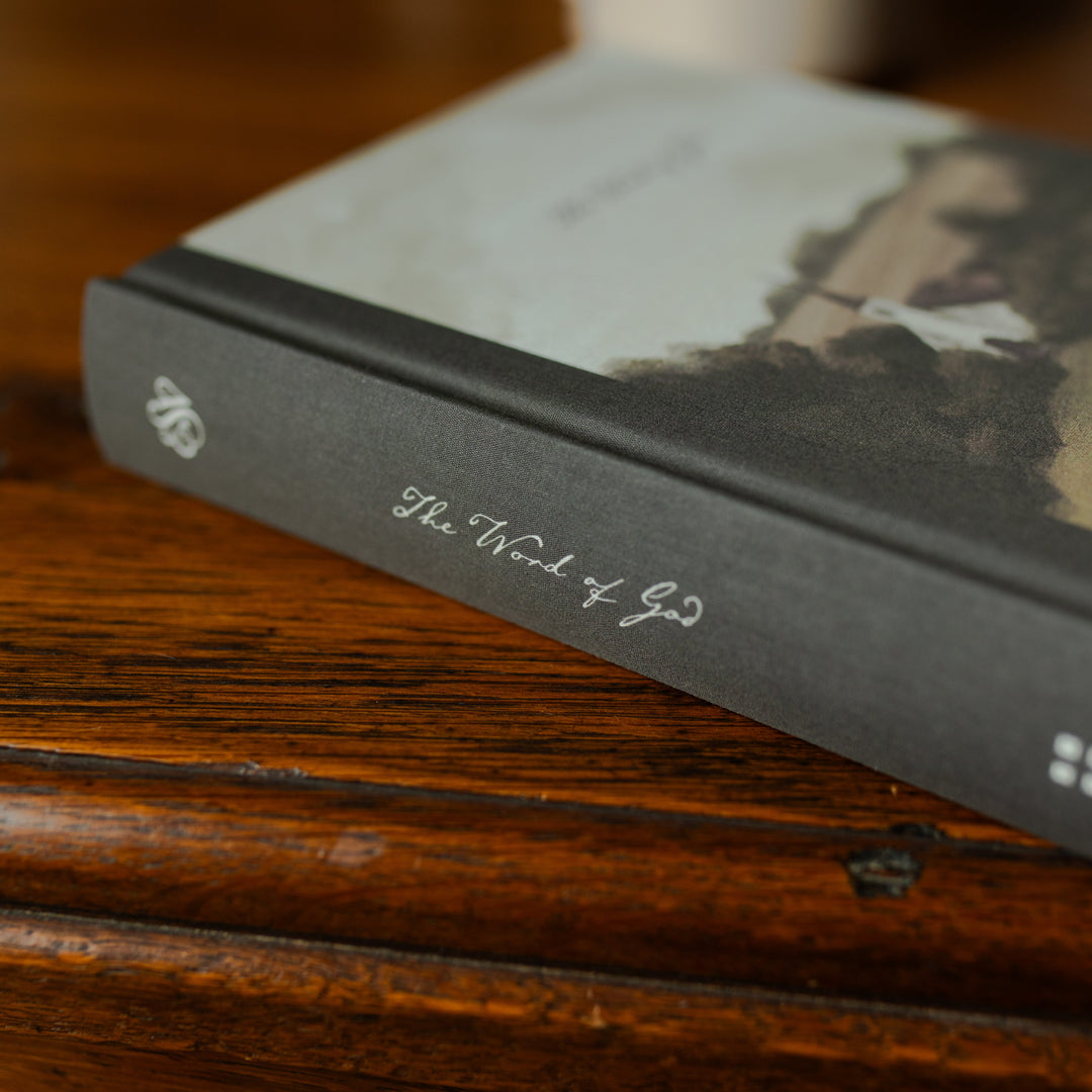 ESV Journaling Good Shepherd Bible spine on a wooden table