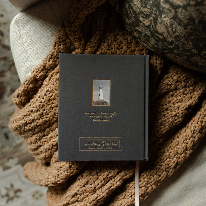 ESV Journaling Lighthouse Bible back cover on a woven blanket and a white couch