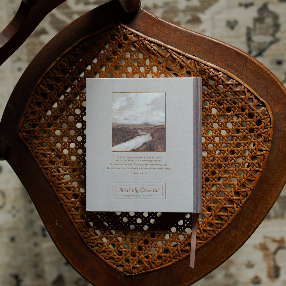 ESV Journaling Still Waters Bible back cover on a oven chair over a rug