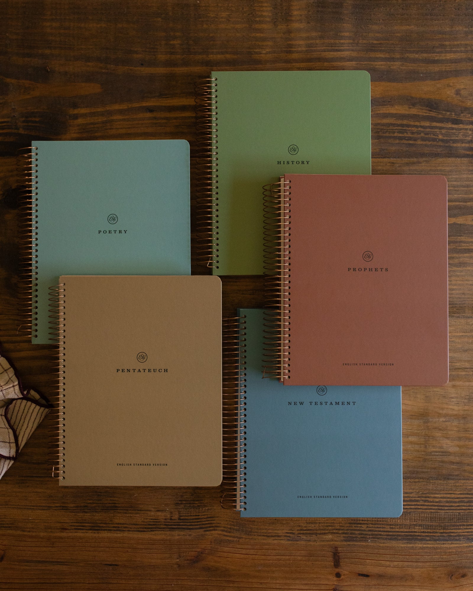 Five Bibles on a table