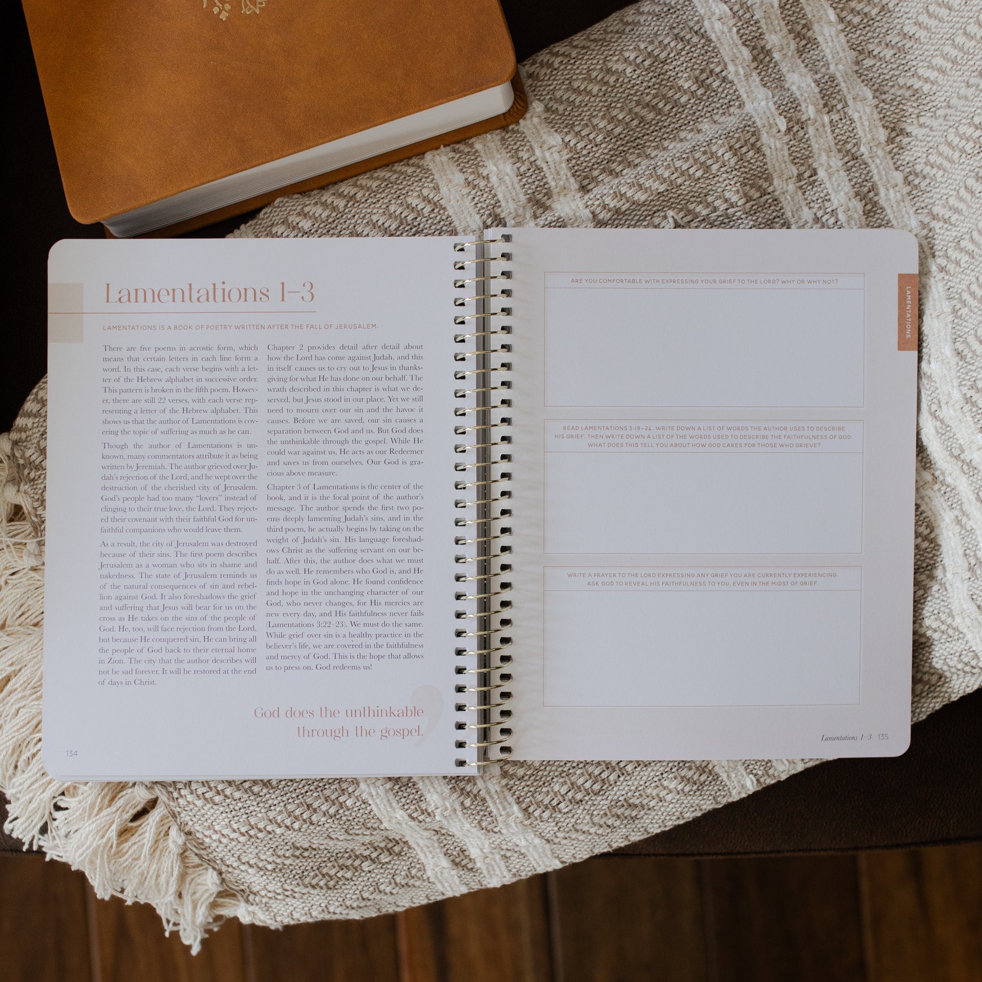 Eden to Eternity Spiral opened to the Lamentations questions section on a textured blanket