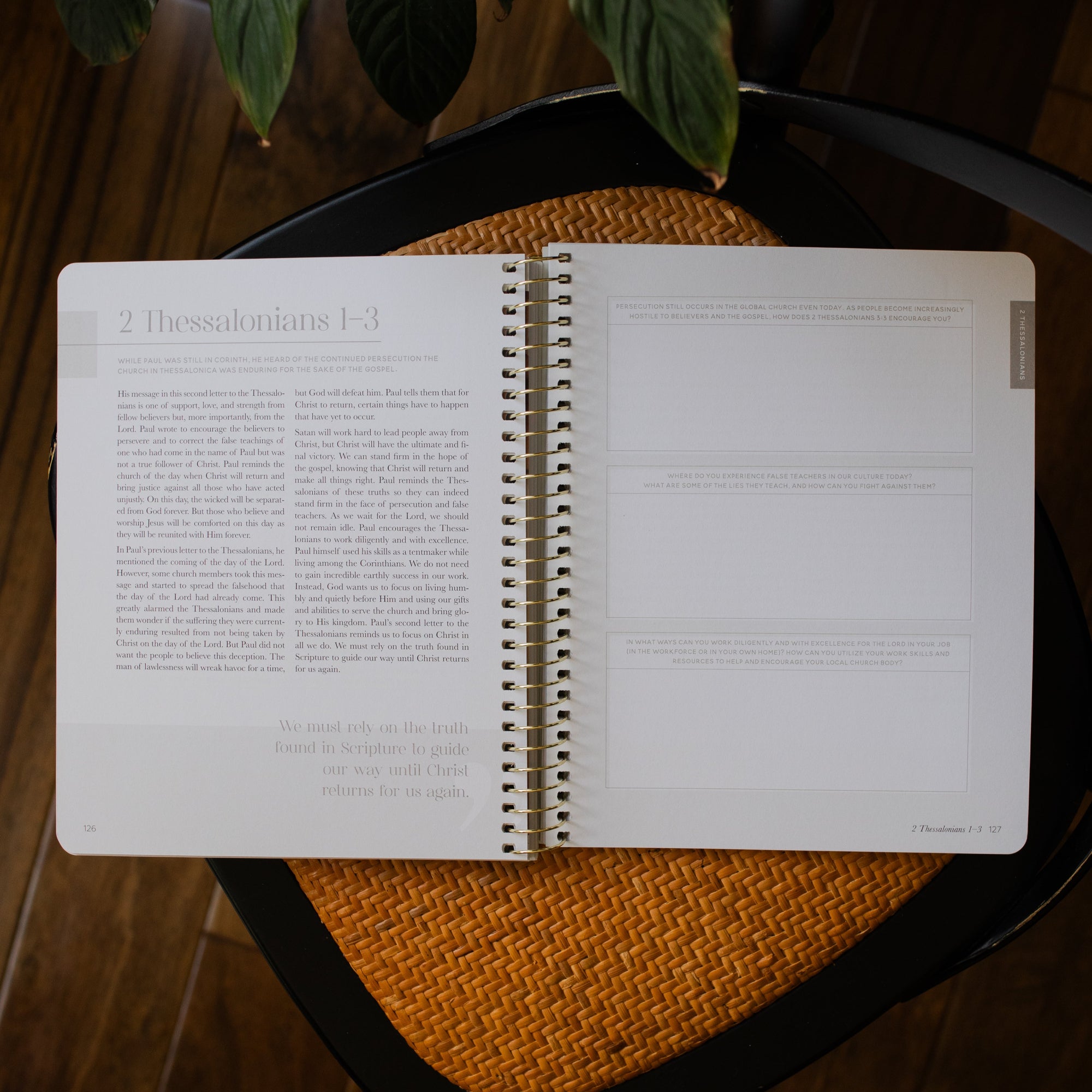 Eden to Eternity Volume 4 opened to Thessalonians questions sections on a woven chair