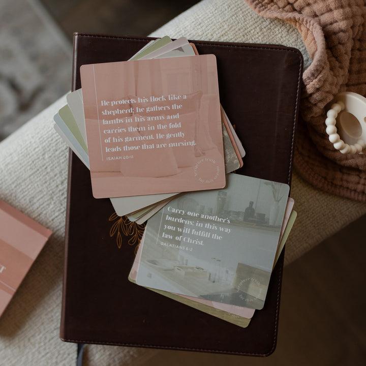 Stack of cards with text on a brown leather case, with a blurred background