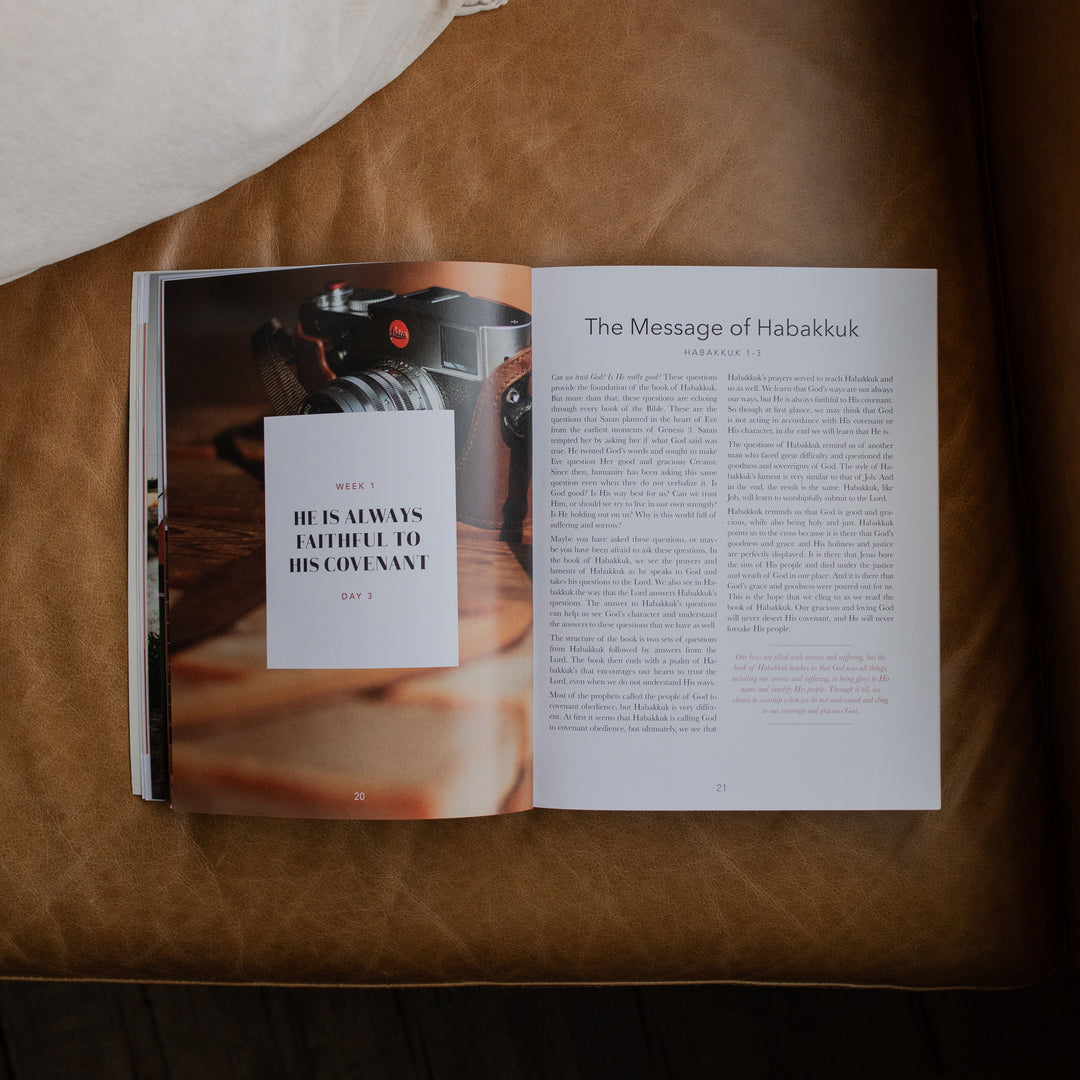 Even If Study opened to the Message of Habakkuk page on a leather couch