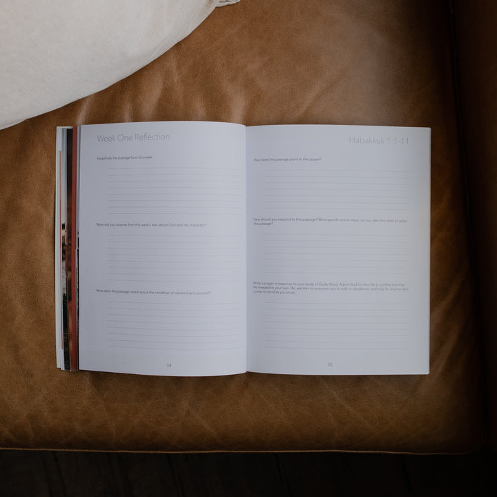 Even If Study opened to the week one reflections page on a leather couch