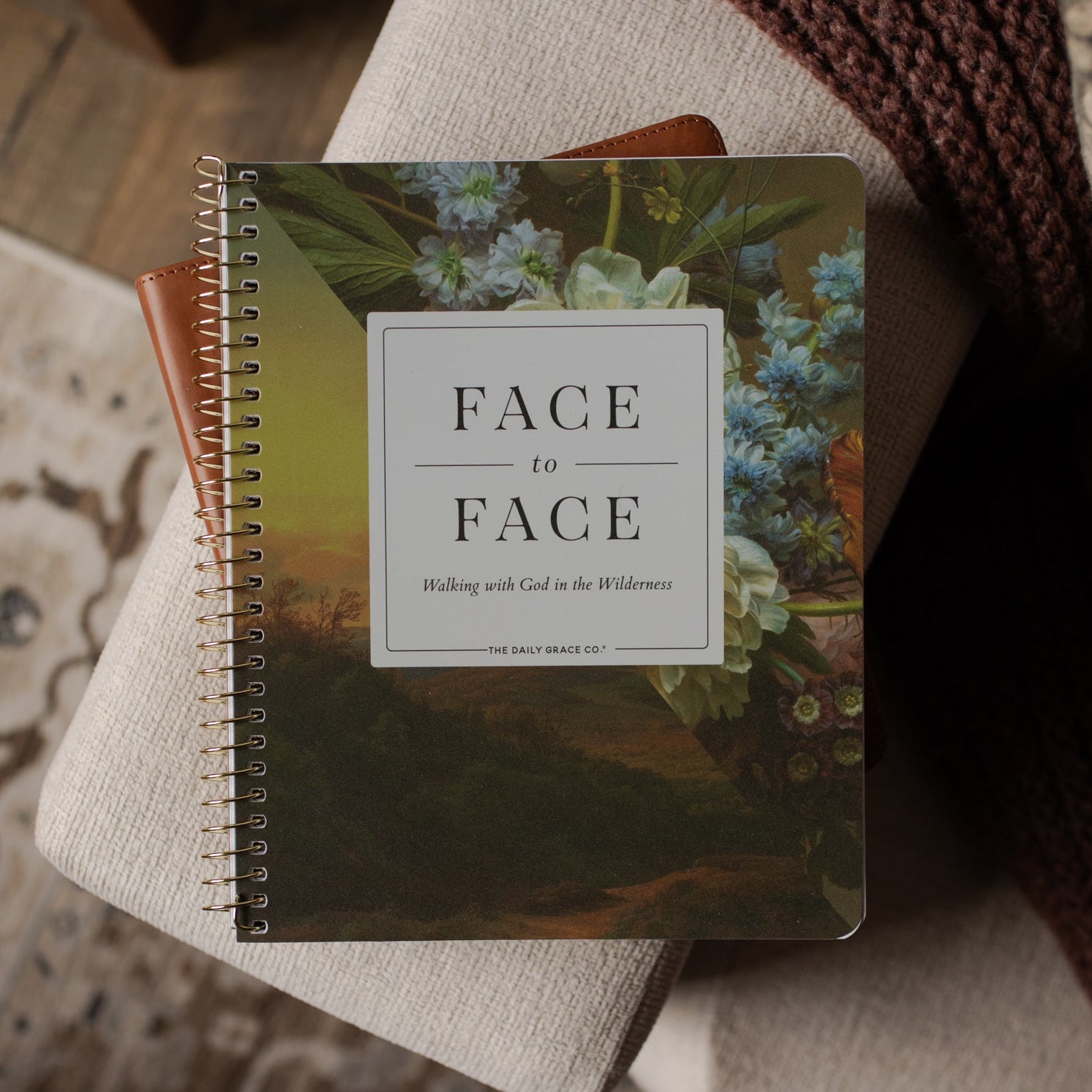 Face to Face Spiral Study cover on a bible on a couch 