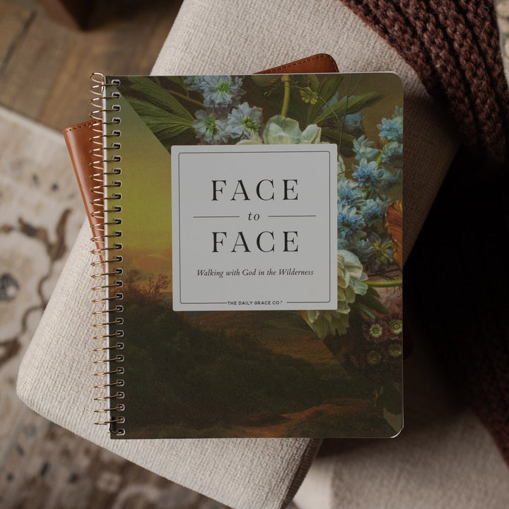 Face to Face Spiral Study cover on a bible on a couch 