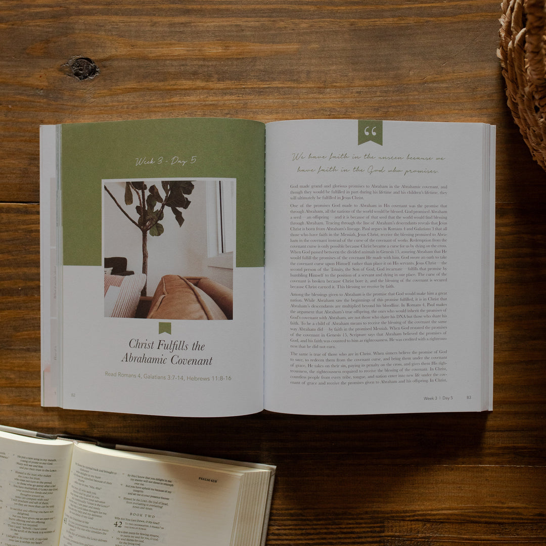 Faithful matte study opened to week 3 day 5 on an wooden table next to an open bible