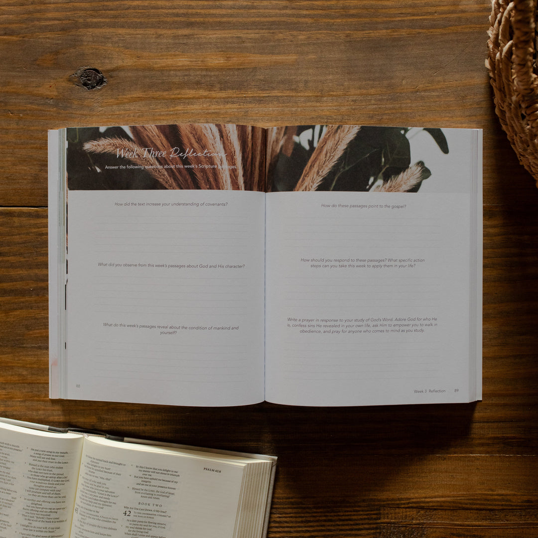 Faithful matte study opened to the week three reflections page on a wooden table next to an open bible