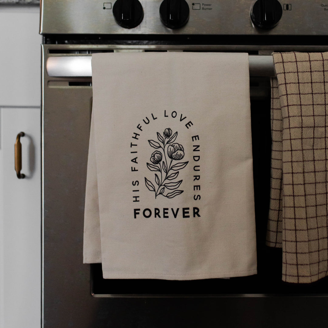 Christian tea towel for home that says His Faithful Love Endures Forever