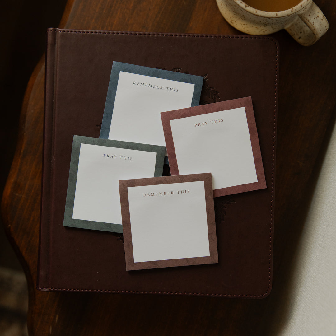 Four stacks of Floral Border Sticky Notes on a closed bible