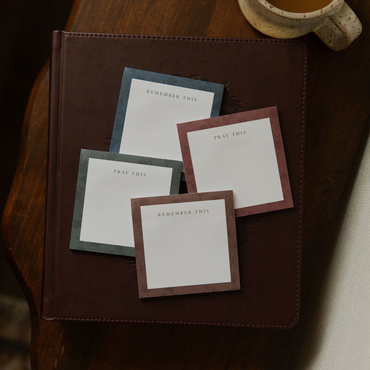 Four stacks of Floral Border Sticky Notes on a closed bible