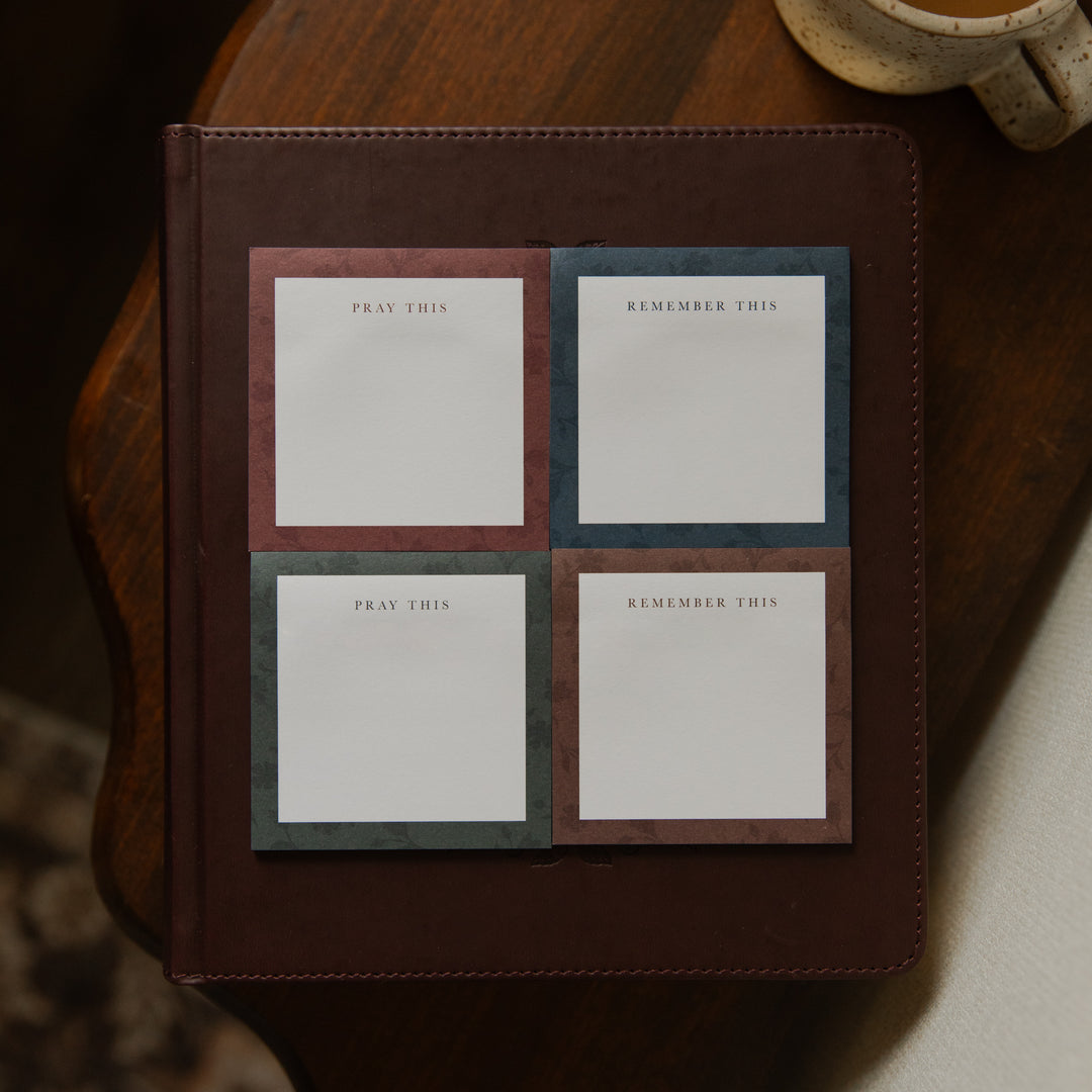 Four stacks of Floral Border Sticky Notes next to each other on a closed bible