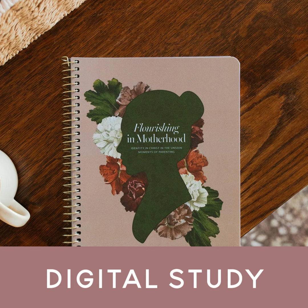 Flourishing in Motherhood spiral study cover on a wooden table near a coffee cup