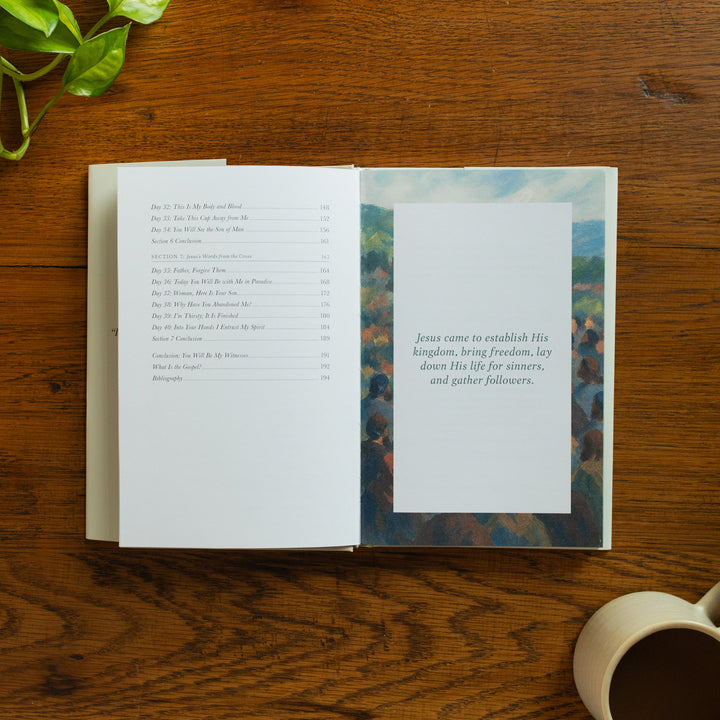 The Forty Sayings of Jesus book on a wooden table opened to the end of the table of contents page