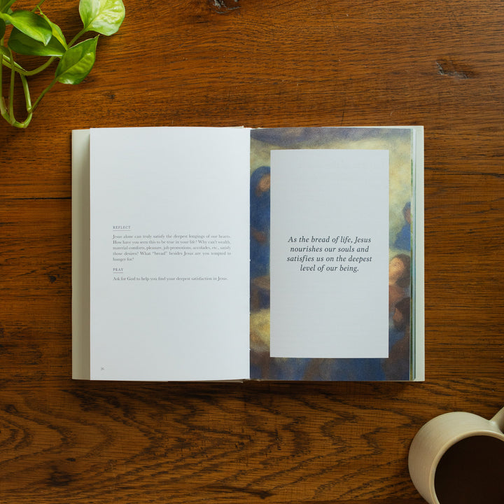 The Forty Sayings of Jesus book on a wooden table opened to the reflect and pray page