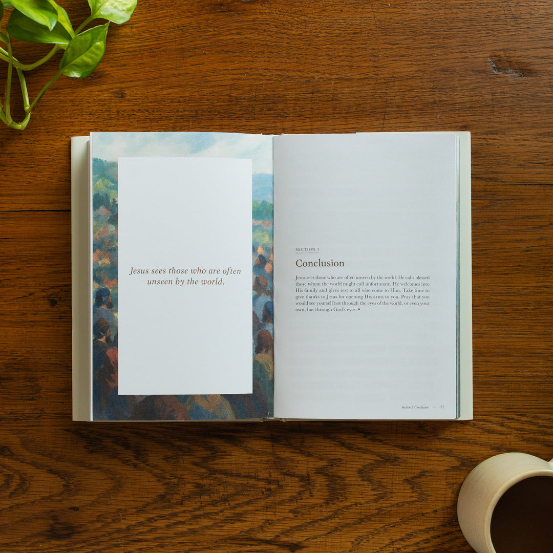 The Forty Sayings of Jesus book on a wooden table opened to the conclusion page