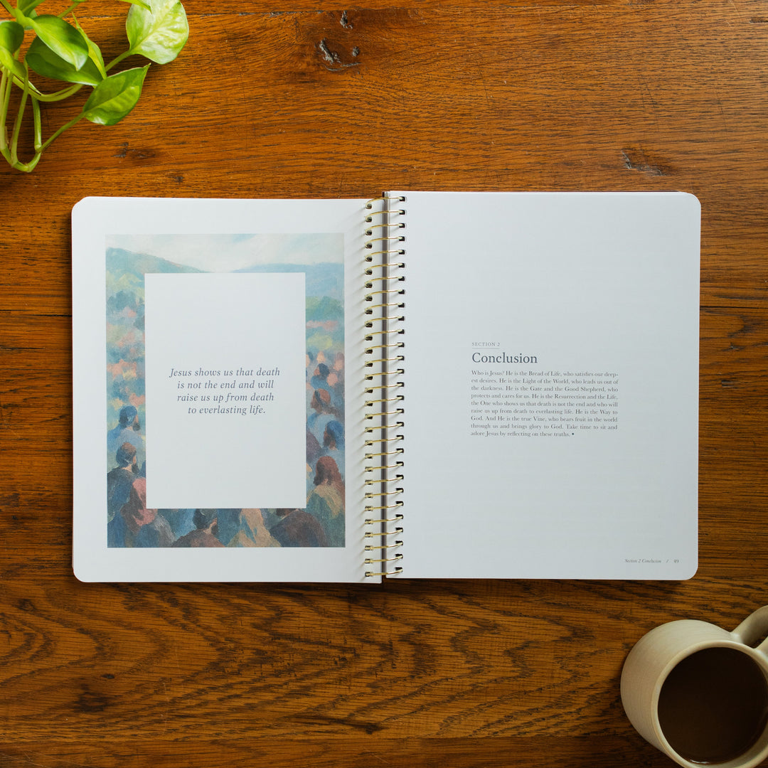 The Forty Sayings of Jesus Spiral opened to the conclusion page on a wooden table