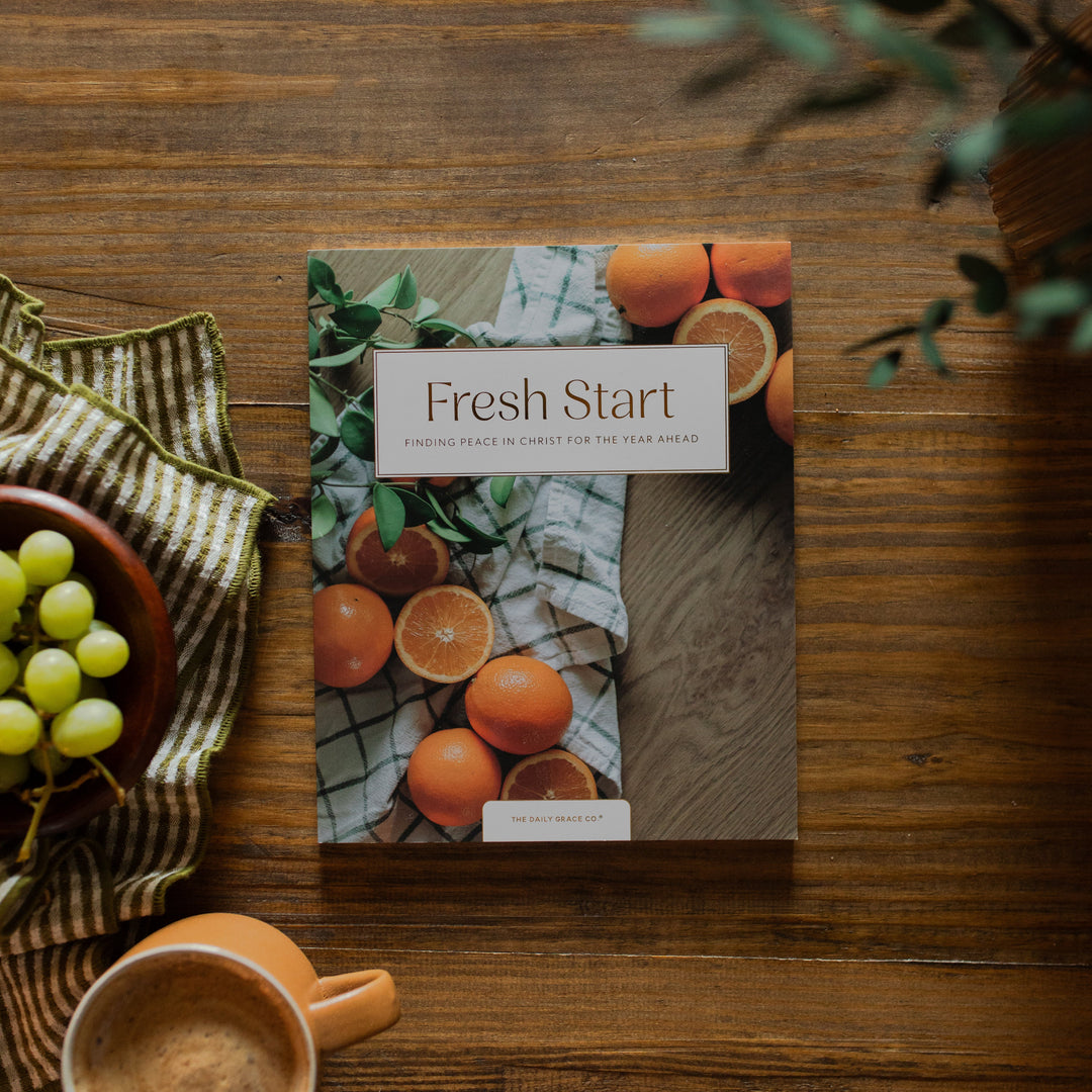 Fresh Start Bible study cover on a wooden table next to a bowl of grapes and a coffee cup